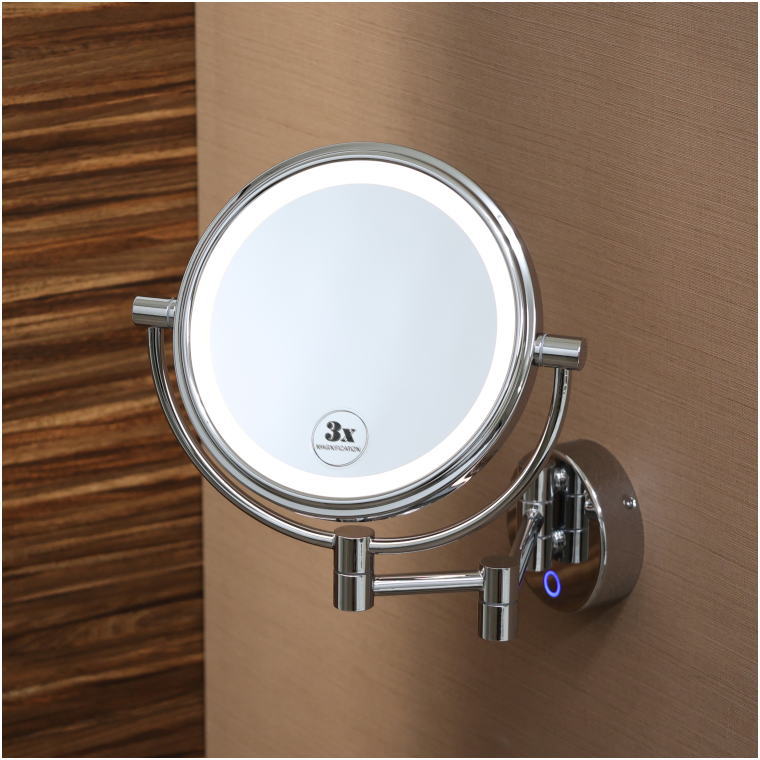 LEDリングが点灯した真鍮製両面ミラー。上方から見た立体的な構図。